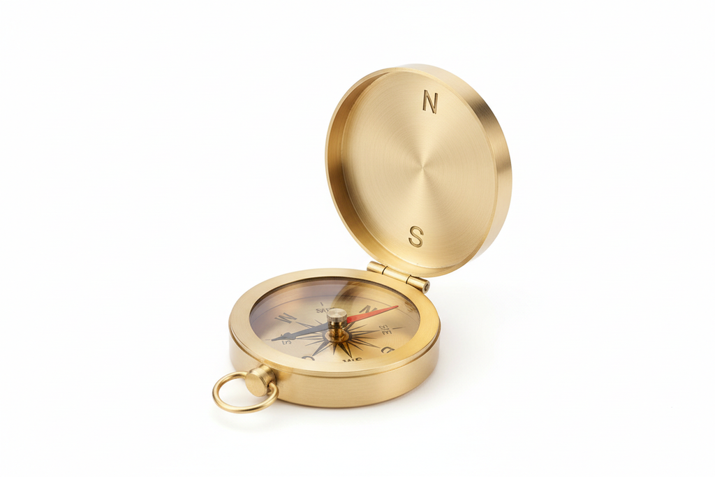 Generate professional e-commerce images of SKU BR-0002, a Premium Brass Directional Compass, on a pure white (#FFFFFF) background.
Show open view, closed view, side profile, top-down, and 45-degree angle.
The compass should look manufacturable with correct hinge structure, engraved dial markings, glass top, and realistic brass reflections. No branding, no engraving, no text, no props.