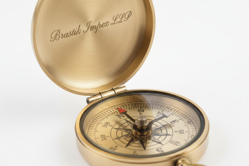 Generate ultra-realistic product images of SKU BR-0001, a Vintage Brass Pocket Compass made from polished brass with light antique finish. Add subtle, manufacturable engraved branding ‘Brastik Impex LLP’ on the inside lid and optionally on the outer lid.
The compass should show the correct dial markings, floating needle, hinge mechanism, and glass top.
Create multiple angles:
• Open lid showing engraved branding
• Closed lid top view with engraved branding
• Side profile showing hinge
• 45-degree hero angle
